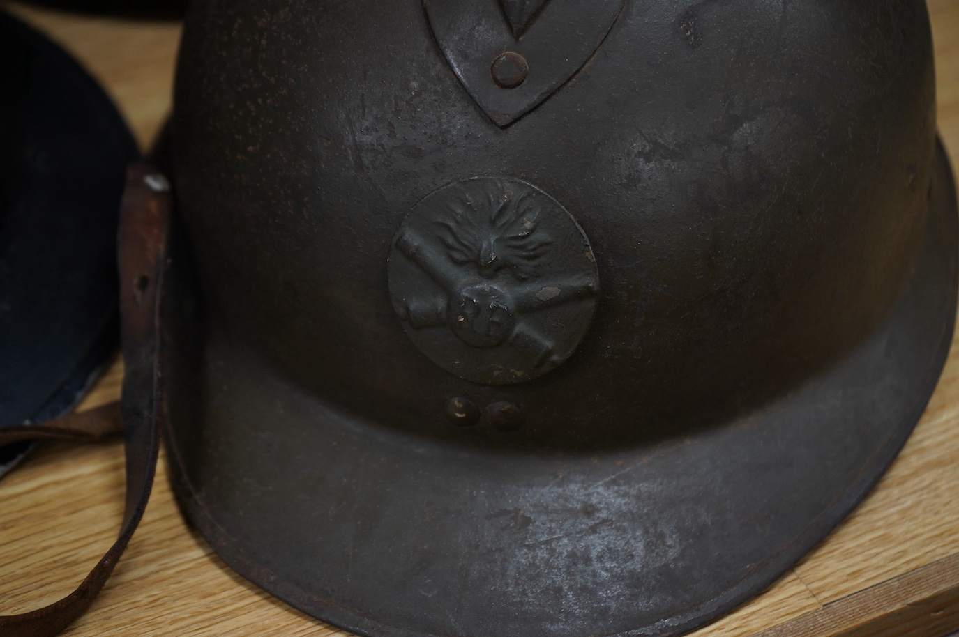 Seven early to mid 20th century military tin helmets; including one stencilled with POLICE. Condition - poor to fair.